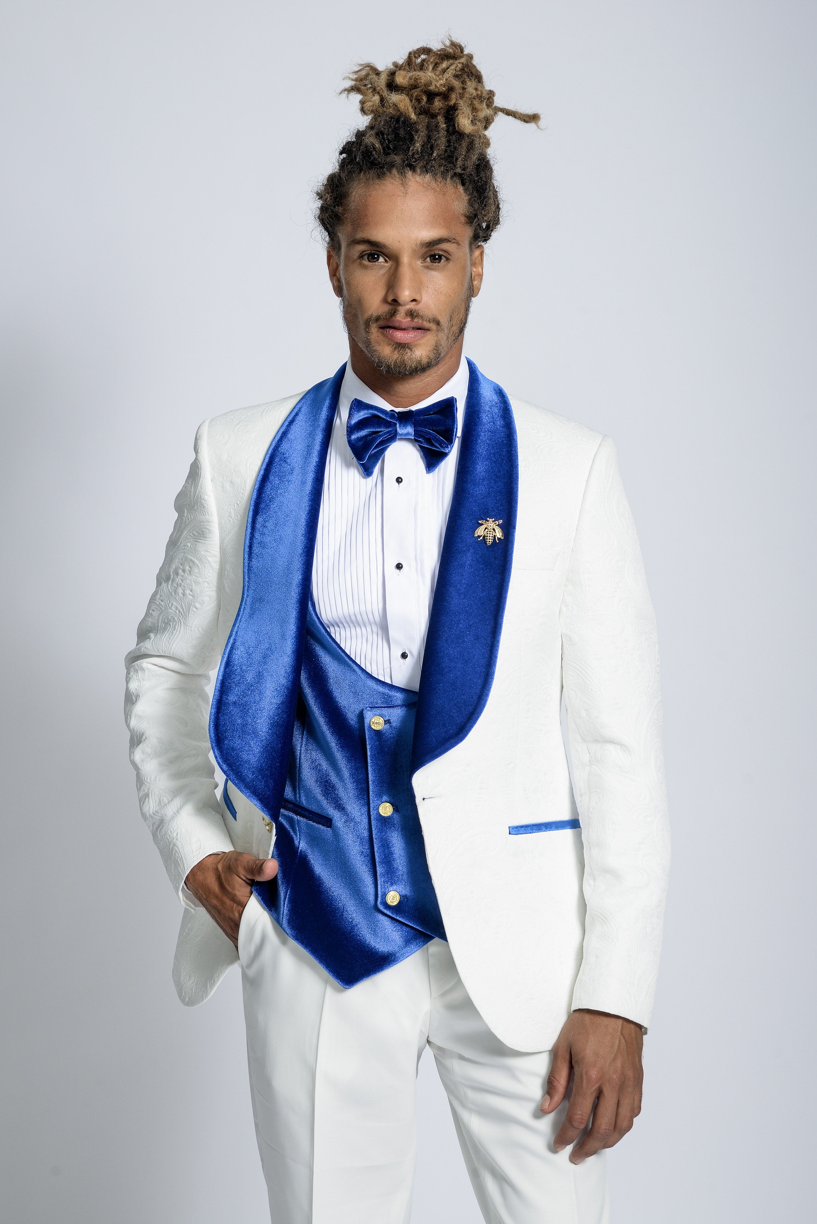 white tuxedo with royal blue vest and tie
